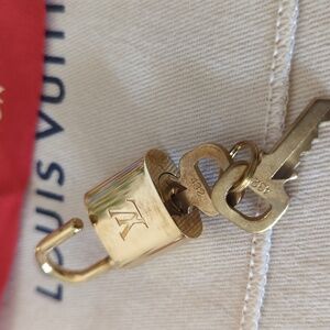 Authentic Louis Vuitton Lock & Keys, dust bag and ribbon #432